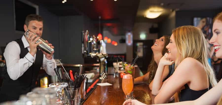 A barman making drinks.