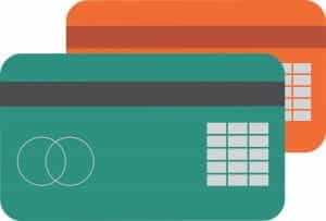 A graphic of two overlaid credit cards, one burnt sienna-colored and the other teal. 